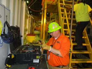 American Safety & Health employees working on fossil equipment